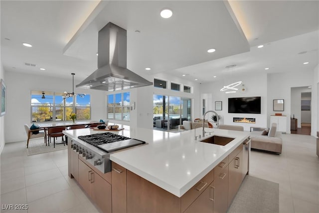 818 Calluna St, Las Vegas, NV 89138 - kitchen featuring stainless steel gas cooktop, island range hood, modern cabinets, a spacious island, and recessed lighting