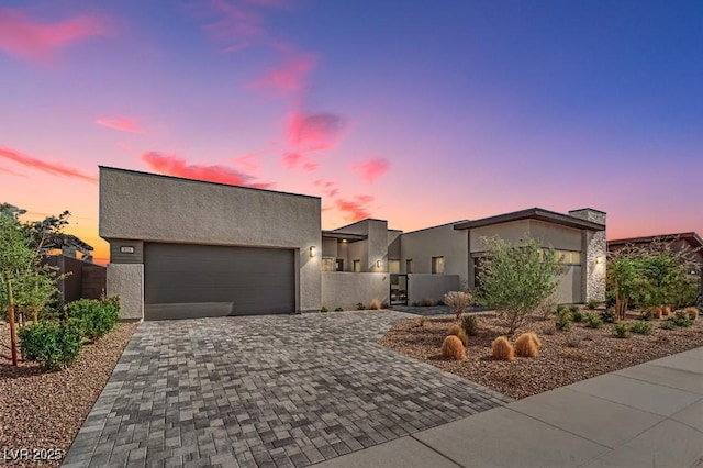818 Calluna St, Las Vegas, NV 89138 - contemporary house featuring driveway, stucco siding, an attached garage, and a gate