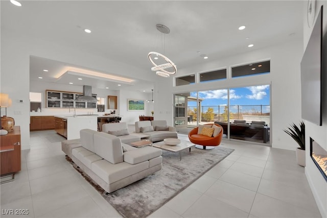 818 Calluna St, Las Vegas, NV 89138 - living room featuring a chandelier, recessed lighting, and light tile patterned floors