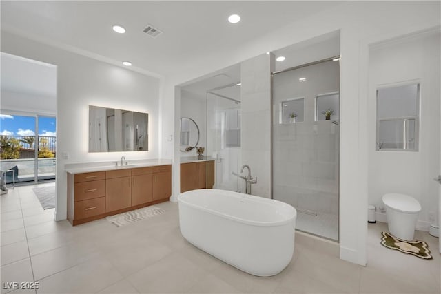 818 Calluna St, Las Vegas, NV 89138 - bathroom featuring a tile shower, vanity, a freestanding tub, recessed lighting, and tile patterned floors