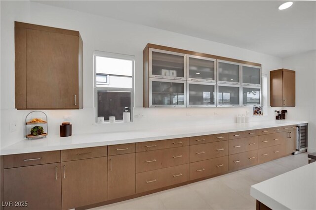 818 Calluna St, Las Vegas, NV 89138 - kitchen with glass insert cabinets, light countertops, and wine cooler
