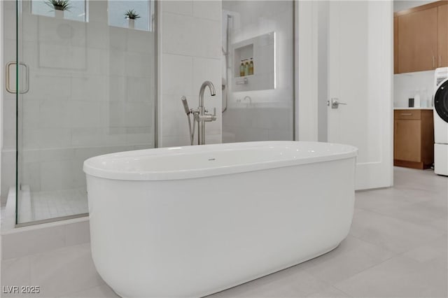 818 Calluna St, Las Vegas, NV 89138 - bathroom with a freestanding bath, a stall shower, and tile patterned flooring