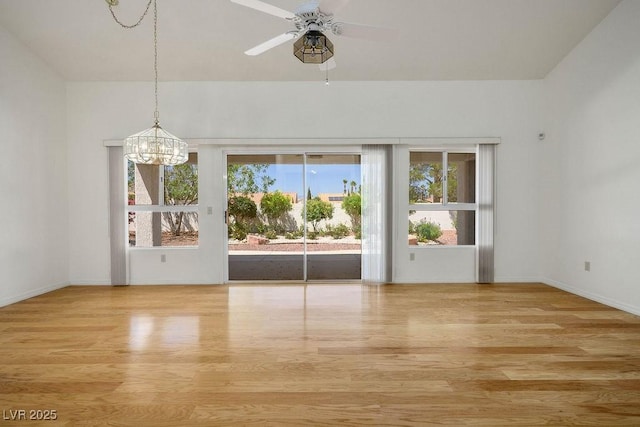 9704 Brawley Dr, Las Vegas, NV 89134 - spare room featuring a chandelier, wood finished floors, and plenty of natural light