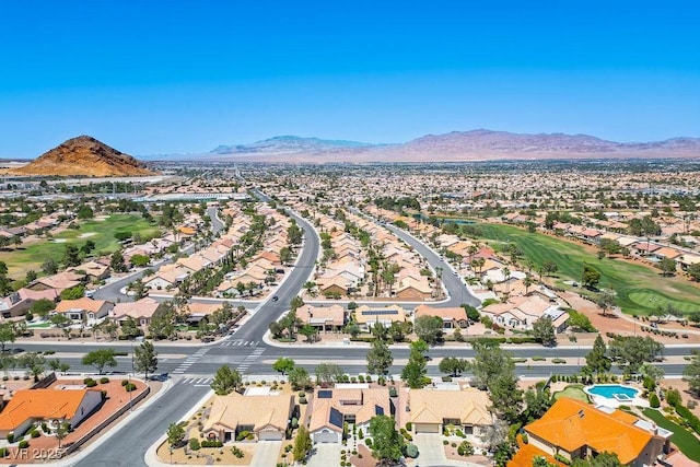 9704 Brawley Dr, Las Vegas, NV 89134 - aerial perspective of suburban area with a mountainous background and a golf club
