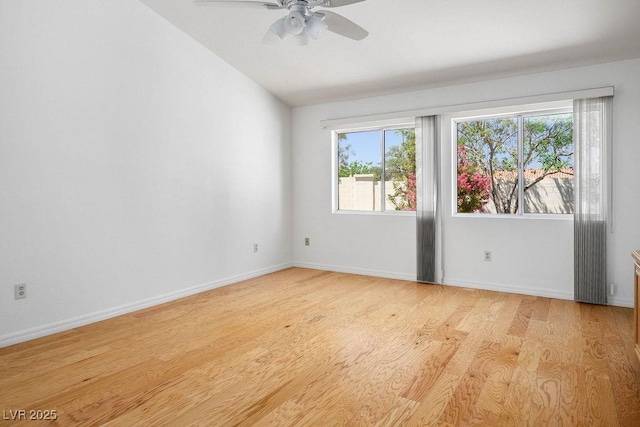 9704 Brawley Dr, Las Vegas, NV 89134 - spare room with light wood-style floors, ceiling fan, and lofted ceiling