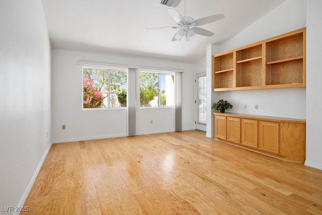 9704 Brawley Dr, Las Vegas, NV 89134 - unfurnished room with lofted ceiling, light wood finished floors, plenty of natural light, and ceiling fan