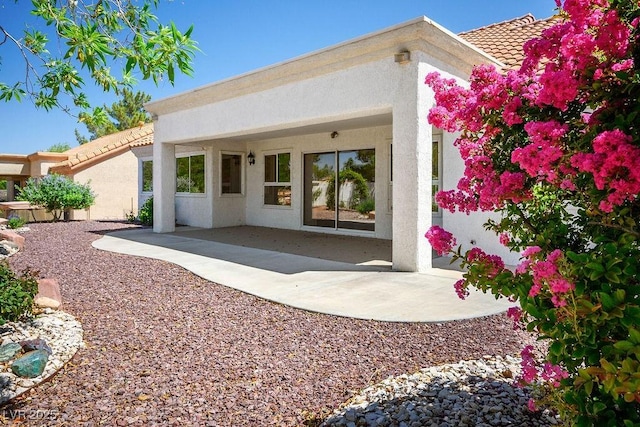 9704 Brawley Dr, Las Vegas, NV 89134 - back of property featuring stucco siding, a patio, and a tile roof