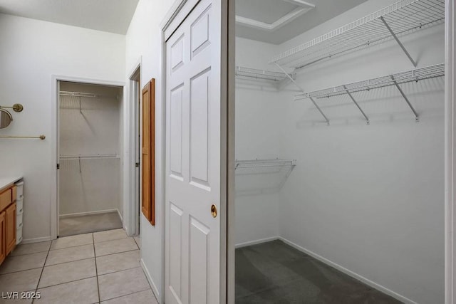 9704 Brawley Dr, Las Vegas, NV 89134 - spacious closet with light tile patterned floors