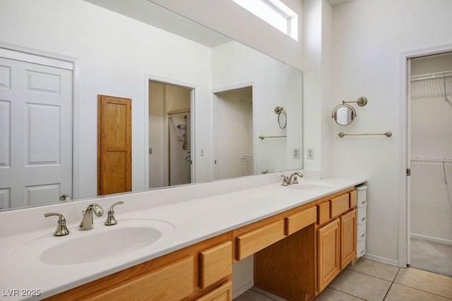 9704 Brawley Dr, Las Vegas, NV 89134 - full bathroom with double vanity, a spacious closet, and tile patterned floors