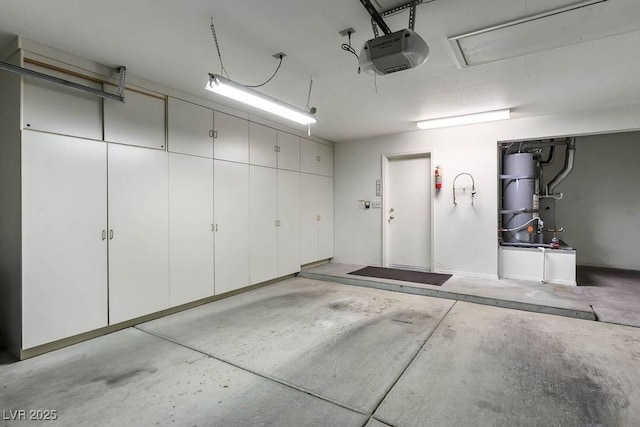 9704 Brawley Dr, Las Vegas, NV 89134 - garage featuring a garage door opener and strapped water heater