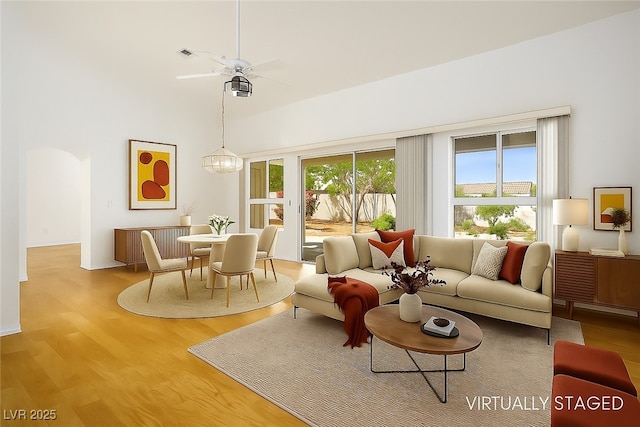 9704 Brawley Dr, Las Vegas, NV 89134 - living area with wood finished floors, radiator heating unit, a high ceiling, and ceiling fan