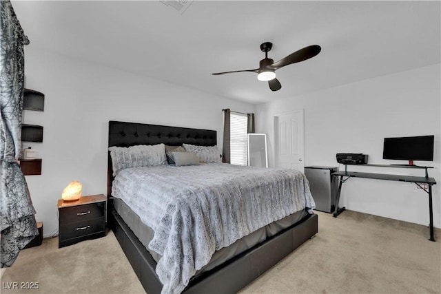 10045 Natchez Trace St, Las Vegas, NV 89178 - bedroom with light colored carpet, ceiling fan, and fridge