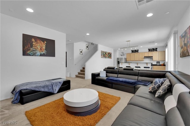 10045 Natchez Trace St, Las Vegas, NV 89178 - living area featuring light carpet, stairway, and recessed lighting