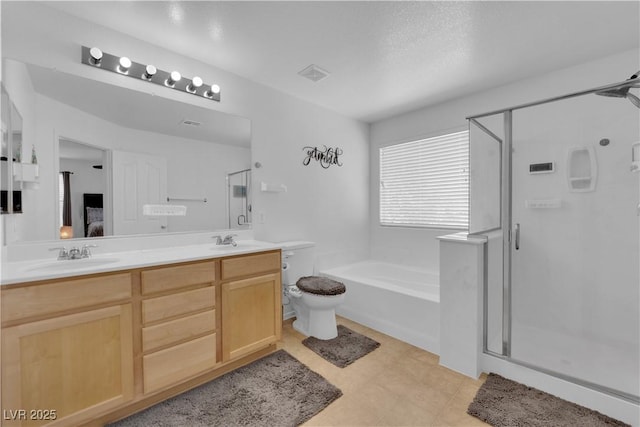 10045 Natchez Trace St, Las Vegas, NV 89178 - full bathroom featuring a shower stall, a bath, and double vanity