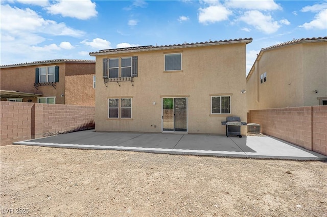 10045 Natchez Trace St, Las Vegas, NV 89178 - back of property with a fenced backyard, a patio area, and stucco siding