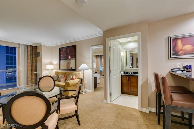 135 E Harmon Ave Unit 2821, Las Vegas, NV 89109 - dining area with light colored carpet and ornamental molding