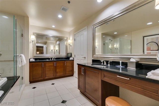 135 E Harmon Ave Unit 2821, Las Vegas, NV 89109 - bathroom featuring a shower with shower door, tile patterned floors, vanity, and recessed lighting