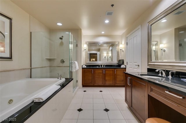 135 E Harmon Ave Unit 2821, Las Vegas, NV 89109 - full bath with a stall shower, a whirlpool tub, tile patterned flooring, vanity, and recessed lighting