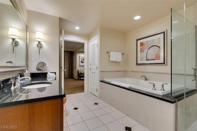 135 E Harmon Ave Unit 2821, Las Vegas, NV 89109 - full bathroom featuring vanity, a bath, tile patterned flooring, and recessed lighting