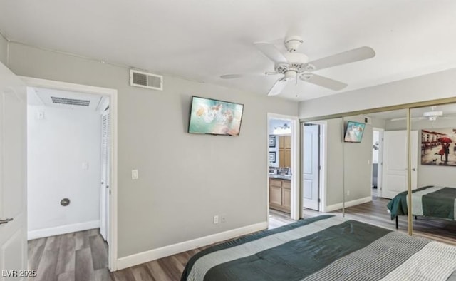 3145 E Flamingo Rd Unit 1045, Las Vegas, NV 89121 - bedroom with wood finished floors, a closet, ensuite bath, and ceiling fan