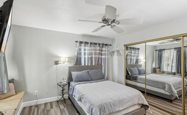 3145 E Flamingo Rd Unit 1045, Las Vegas, NV 89121 - bedroom with a closet, wood finished floors, and ceiling fan