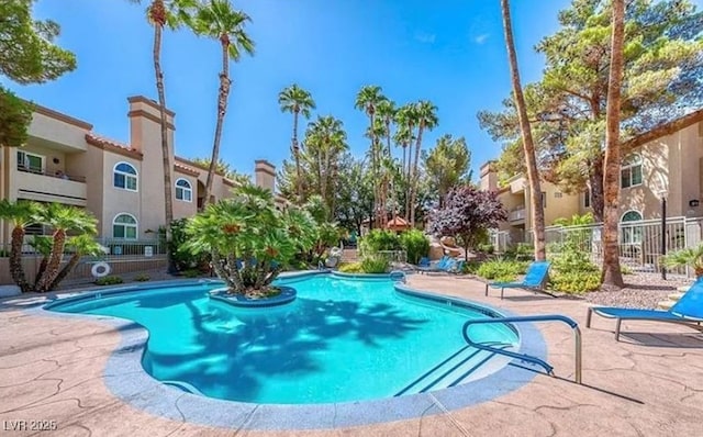 3145 E Flamingo Rd Unit 1045, Las Vegas, NV 89121 - community pool featuring a patio and a residential view