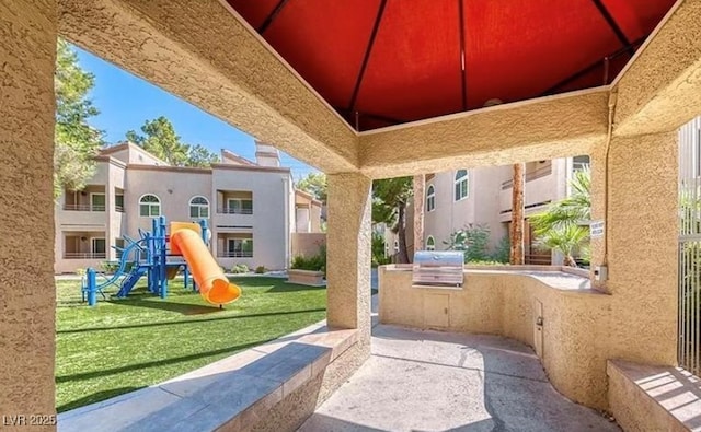3145 E Flamingo Rd Unit 1045, Las Vegas, NV 89121 - view of patio featuring area for grilling and a playground