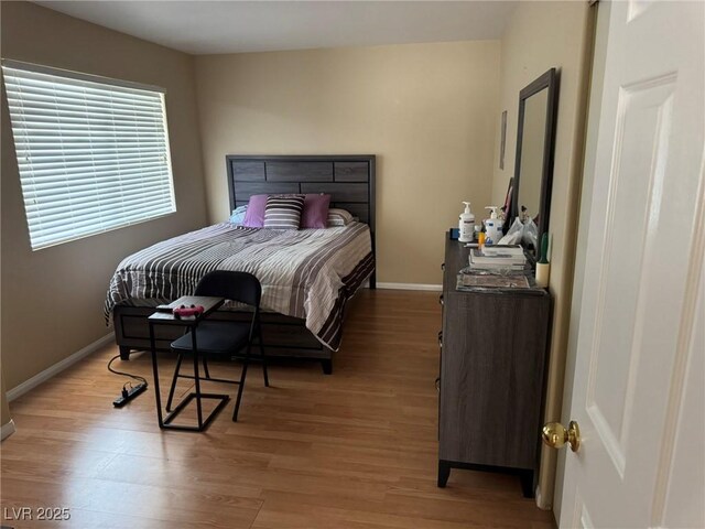 8225 Bermuda Beach Dr, Las Vegas, NV 89128 - bedroom featuring light wood-style flooring
