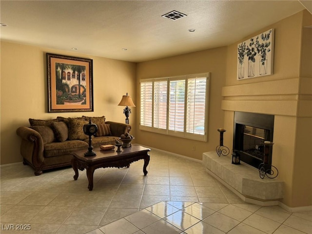 8225 Bermuda Beach Dr, Las Vegas, NV 89128 - living area with light tile patterned flooring, a glass covered fireplace, and recessed lighting