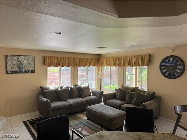 8225 Bermuda Beach Dr, Las Vegas, NV 89128 - living area with light tile patterned flooring, healthy amount of natural light, and a textured ceiling