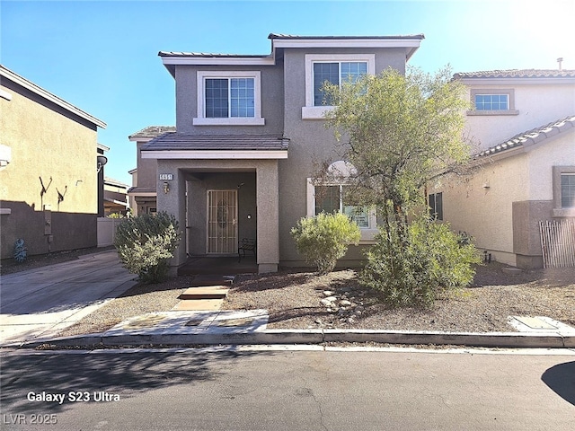 5651 Bettors Luck Ct, Las Vegas, NV 89122 - traditional-style house with stucco siding and a tile roof