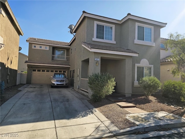 5651 Bettors Luck Ct, Las Vegas, NV 89122 - traditional-style house featuring a garage, a balcony, concrete driveway, and stucco siding