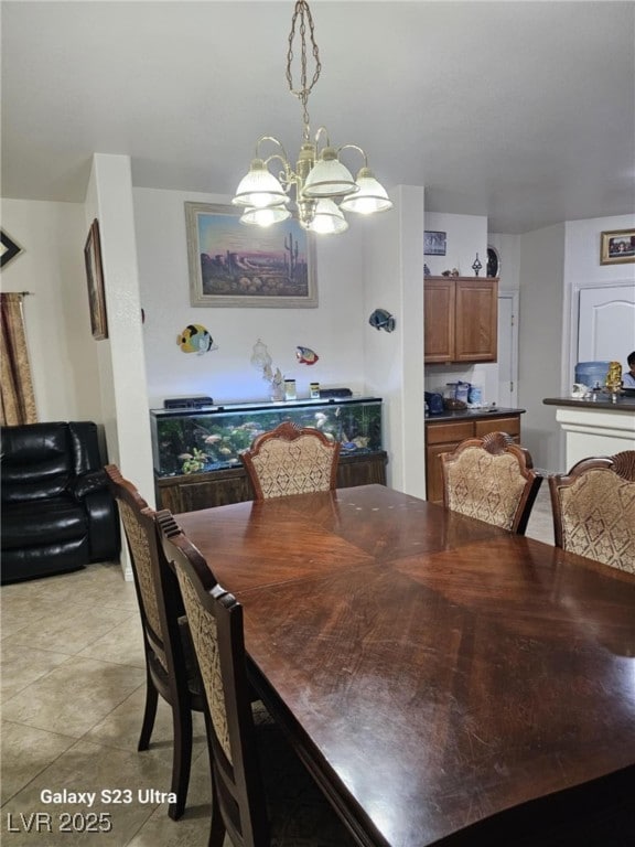 5651 Bettors Luck Ct, Las Vegas, NV 89122 - dining space featuring a chandelier and light tile patterned flooring