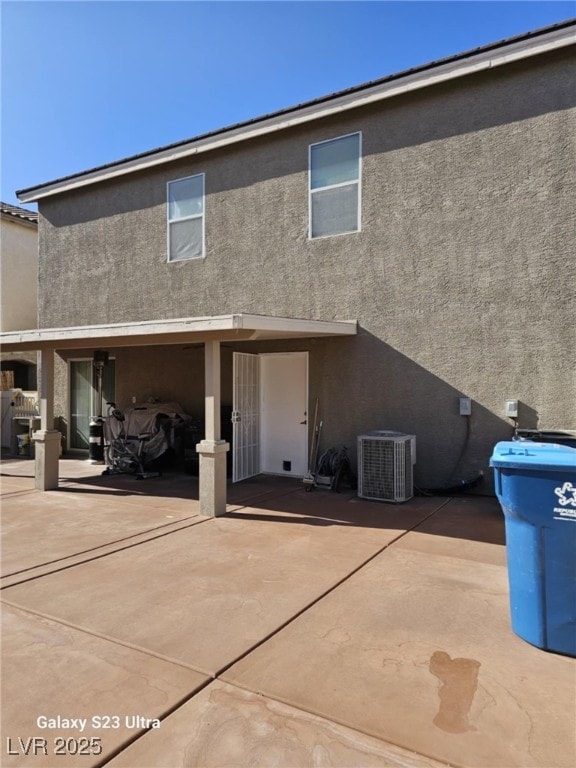 5651 Bettors Luck Ct, Las Vegas, NV 89122 - back of property with stucco siding and a patio