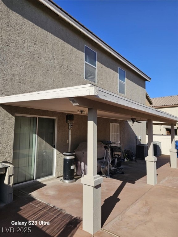 5651 Bettors Luck Ct, Las Vegas, NV 89122 - rear view of house with a patio area, stucco siding, and a ceiling fan