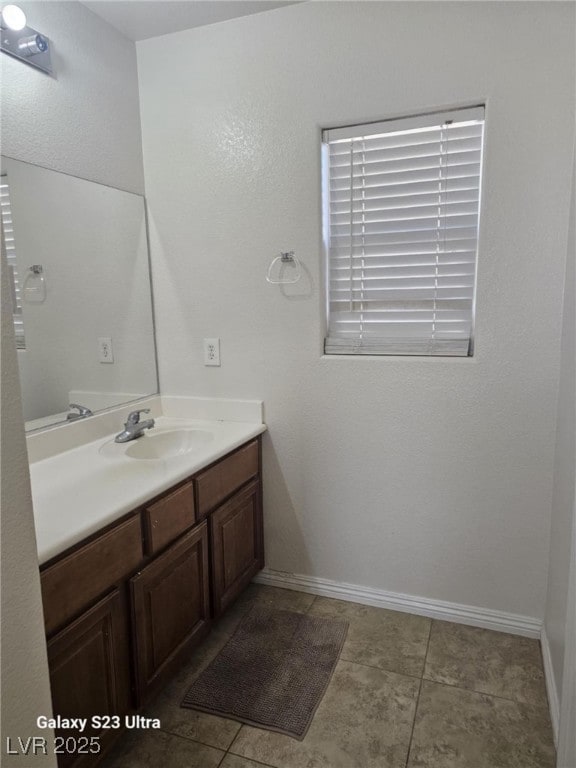 5651 Bettors Luck Ct, Las Vegas, NV 89122 - bathroom with vanity and baseboards