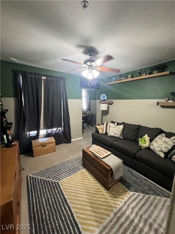 3975 N Hualapai Way Unit 246, Las Vegas, NV 89129 - carpeted living room featuring a textured ceiling and ceiling fan