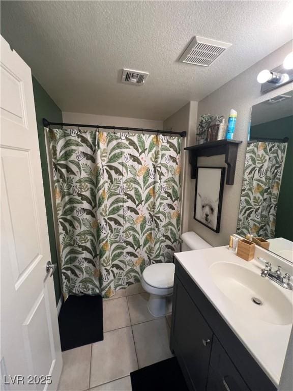 3975 N Hualapai Way Unit 246, Las Vegas, NV 89129 - full bath with vanity, tile patterned floors, and a textured ceiling