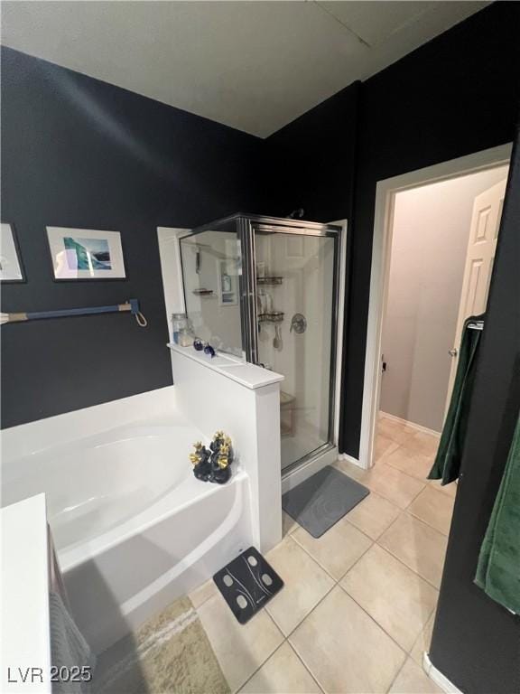3975 N Hualapai Way Unit 246, Las Vegas, NV 89129 - full bathroom with a shower stall, a bath, and tile patterned floors
