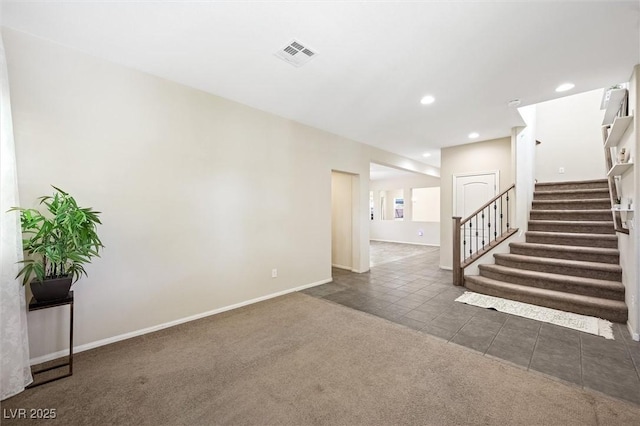 6713 Guidestar St, North Las Vegas, NV 89084 - unfurnished living room with stairs, tile patterned flooring, carpet, and recessed lighting