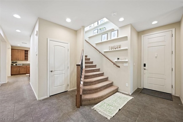 6713 Guidestar St, North Las Vegas, NV 89084 - entryway featuring recessed lighting, stairway, and dark tile patterned floors