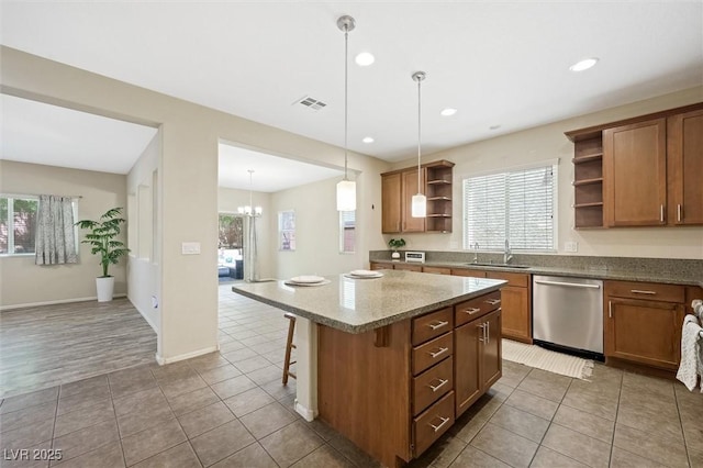 6713 Guidestar St, North Las Vegas, NV 89084 - kitchen with open shelves, stainless steel dishwasher, plenty of natural light, a center island, and recessed lighting