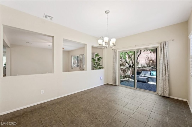 6713 Guidestar St, North Las Vegas, NV 89084 - spare room with a chandelier and dark tile patterned flooring