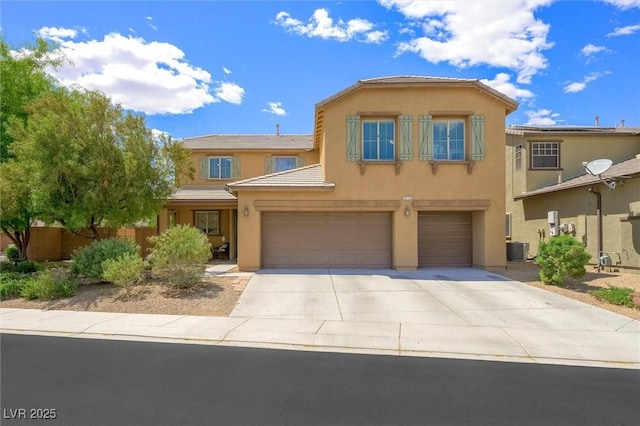 6713 Guidestar St, North Las Vegas, NV 89084 - view of front of property featuring stucco siding, a garage, and driveway