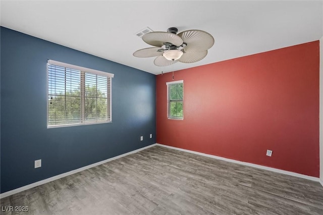 6713 Guidestar St, North Las Vegas, NV 89084 - unfurnished room featuring wood finished floors and a ceiling fan