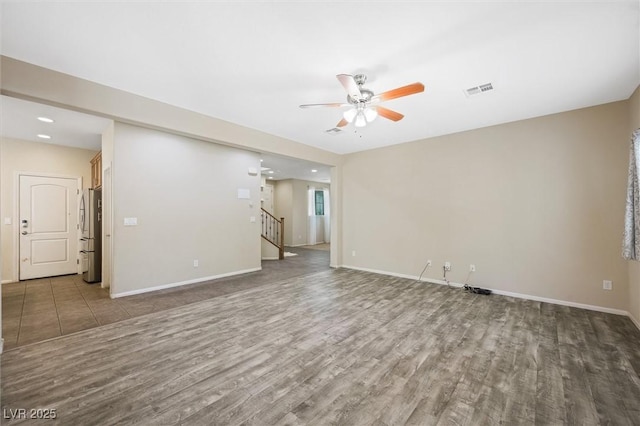 6713 Guidestar St, North Las Vegas, NV 89084 - spare room featuring ceiling fan, wood finished floors, stairs, and recessed lighting