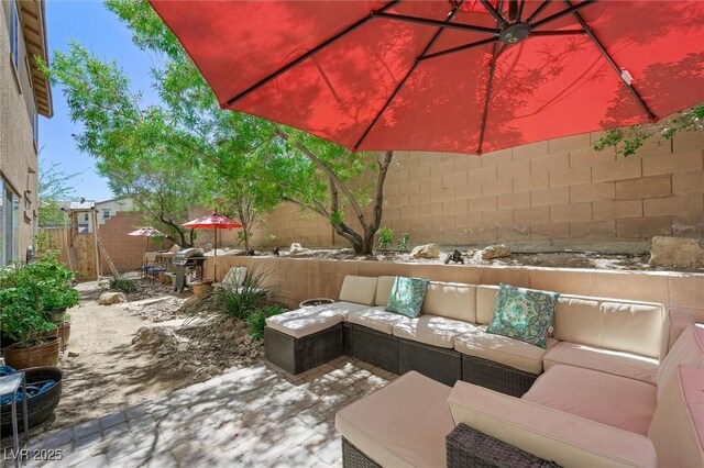 6713 Guidestar St, North Las Vegas, NV 89084 - fenced backyard featuring an outdoor hangout area and a patio area