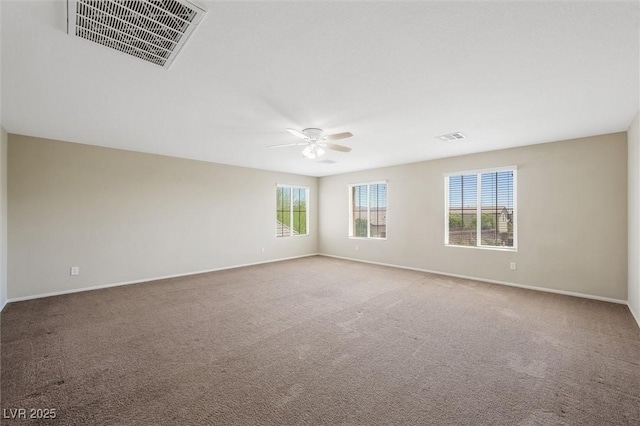 6713 Guidestar St, North Las Vegas, NV 89084 - carpeted spare room with a ceiling fan and baseboards