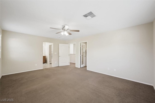 6713 Guidestar St, North Las Vegas, NV 89084 - unfurnished bedroom featuring a walk in closet, carpet floors, ensuite bath, and a ceiling fan