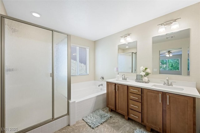 6713 Guidestar St, North Las Vegas, NV 89084 - bathroom featuring a shower stall, double vanity, a bath, and ceiling fan